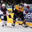 MINSK, BELARUS - MAY 20: Germany's Frank Hordler #48 plays the puck while USA's Brock Nelson #11 and Craig Smith #15 defend during preliminary round action at the 2014 IIHF Ice Hockey World Championship. (Photo by Andre Ringuette/HHOF-IIHF Images)